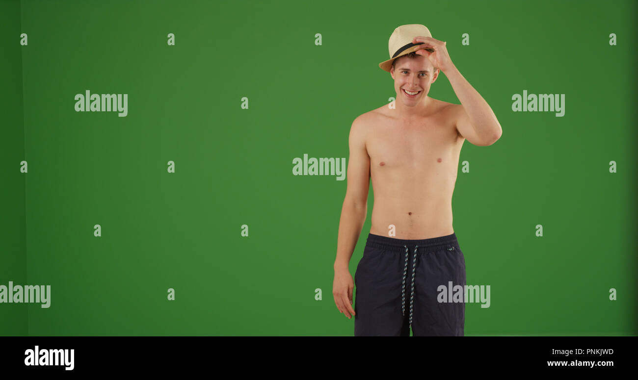 Man wearing with hat and swimsuit posing shirtless on green screen Stock  Photo - Alamy