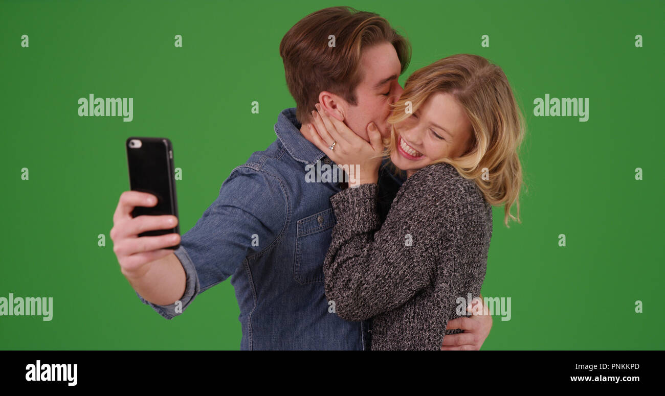 Man and woman kissing on screen hi-res stock photography and images - Alamy