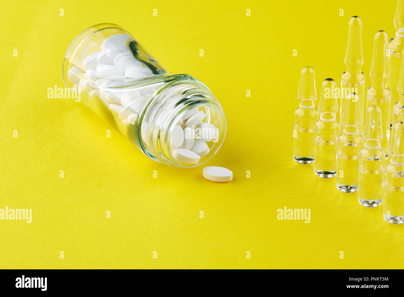 Download Bottle With Tablets And Ampoules On Yellow Background Stock Photo Alamy Yellowimages Mockups