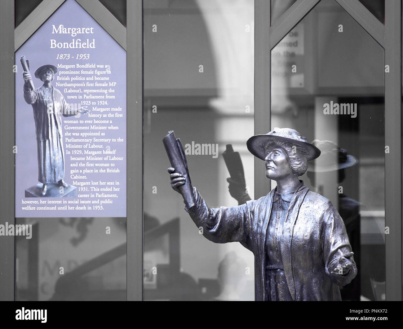Metal statue and brief biography of Margaret Bondfield (first female cabinet minister in a UK government), courtyard of the Guildhall, Northampton. Stock Photo