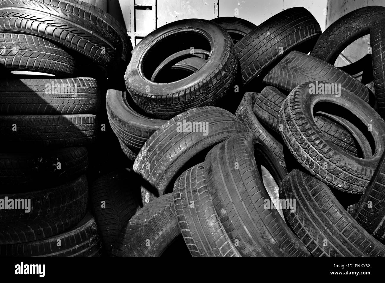 stack of abandoned and damaged tyres Stock Photo