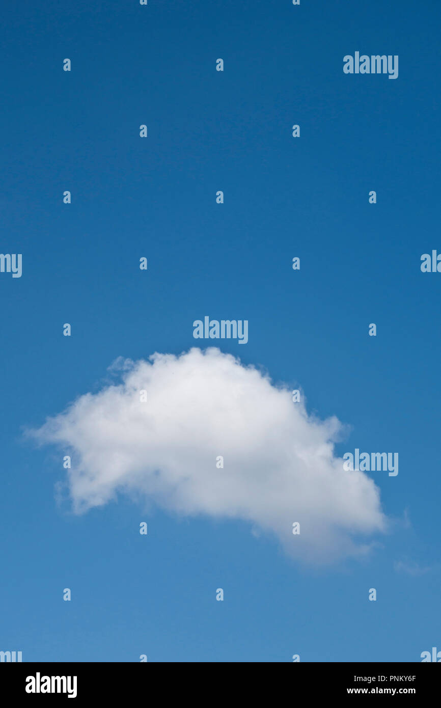 single cumulus white cloud on a blue sky Stock Photo