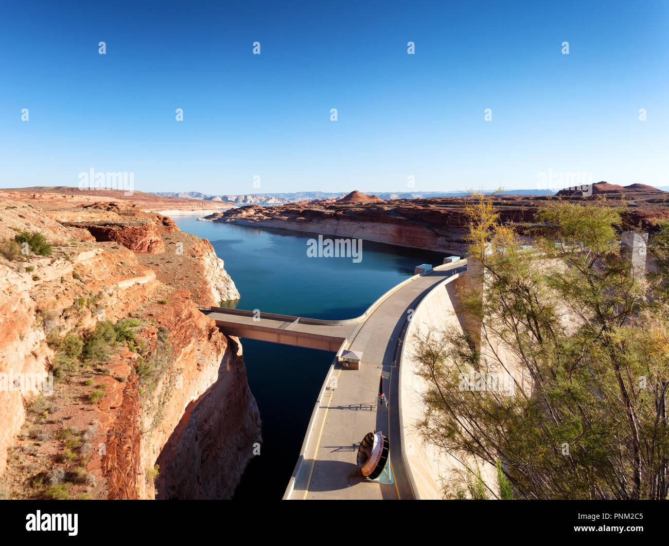 Glen Canyon Dam producing clean electricity with hydropower on Colorado River Stock Photo