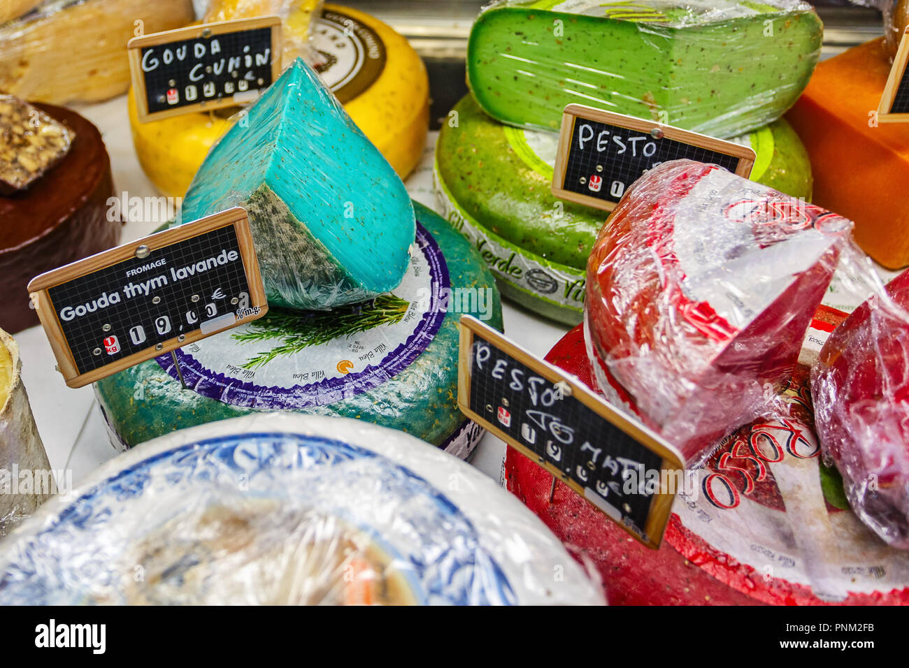 DIJON, FRANCE - AUGUST 10, 2017: Different kinds of cheeses on the market in Dijon Stock Photo
