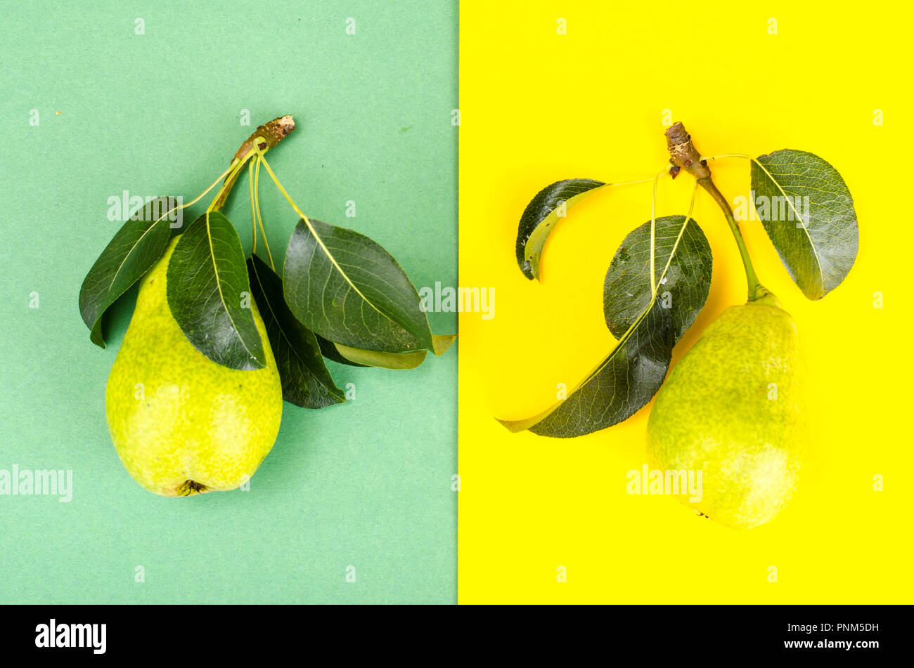 Sweet ripe fruit on bright paper background. Studio Photo Stock Photo ...