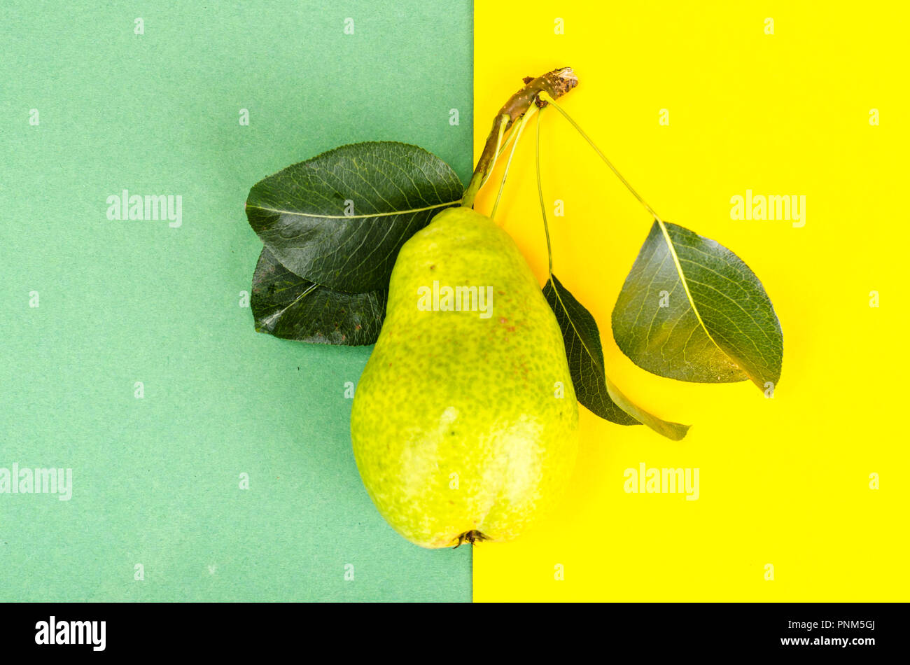 Sweet ripe fruit on bright paper background. Studio Photo Stock Photo ...