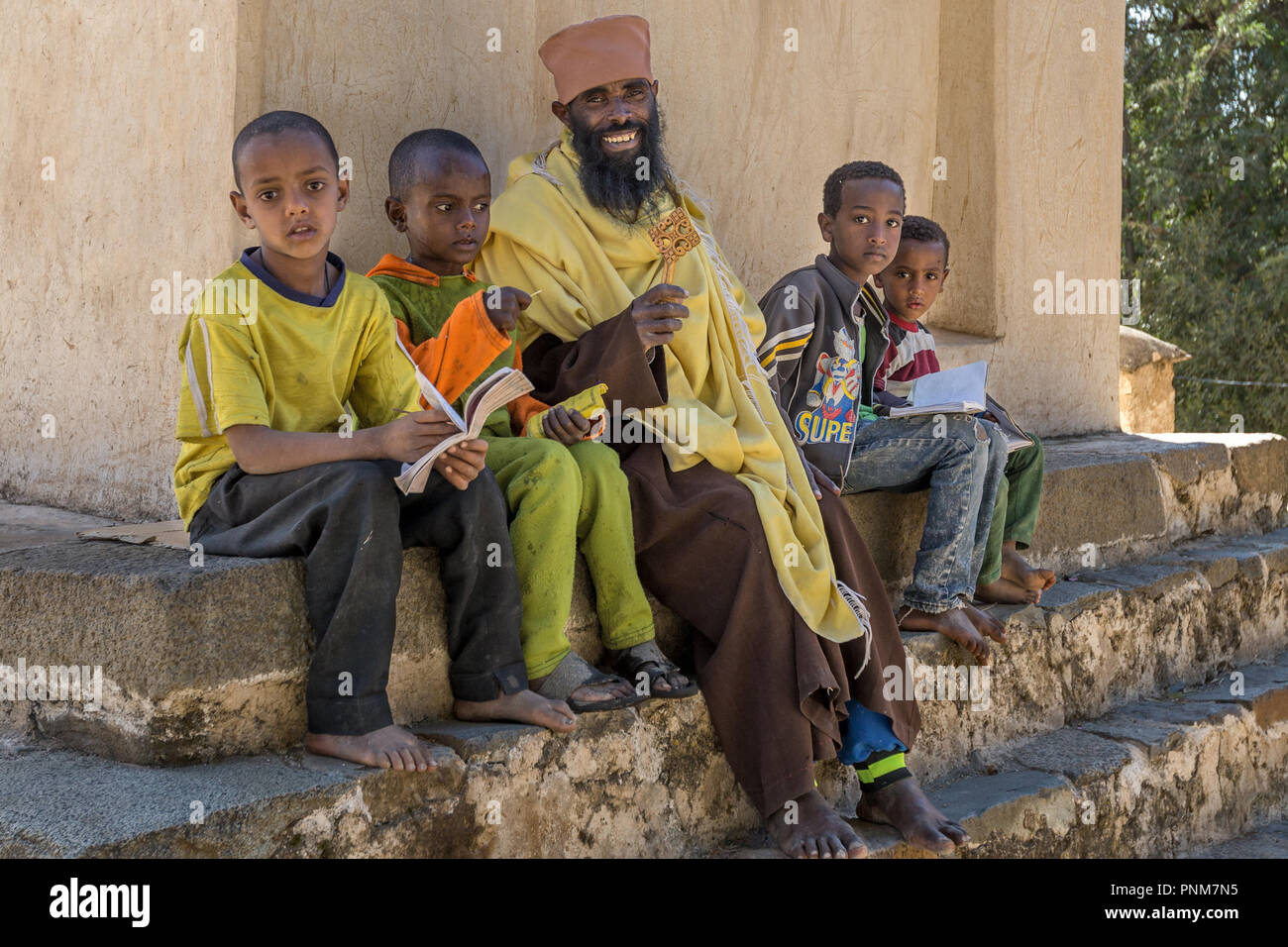 Monk teaching children, Church founded by Gonder, Cathedral of Tsion Maryan, St. Mary of Zion complex, Axum, Ethiopia Stock Photo