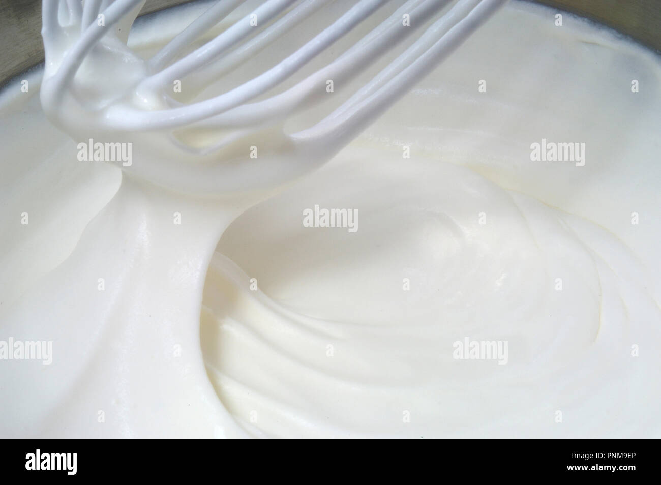 whipping cream manually Stock Photo Alamy