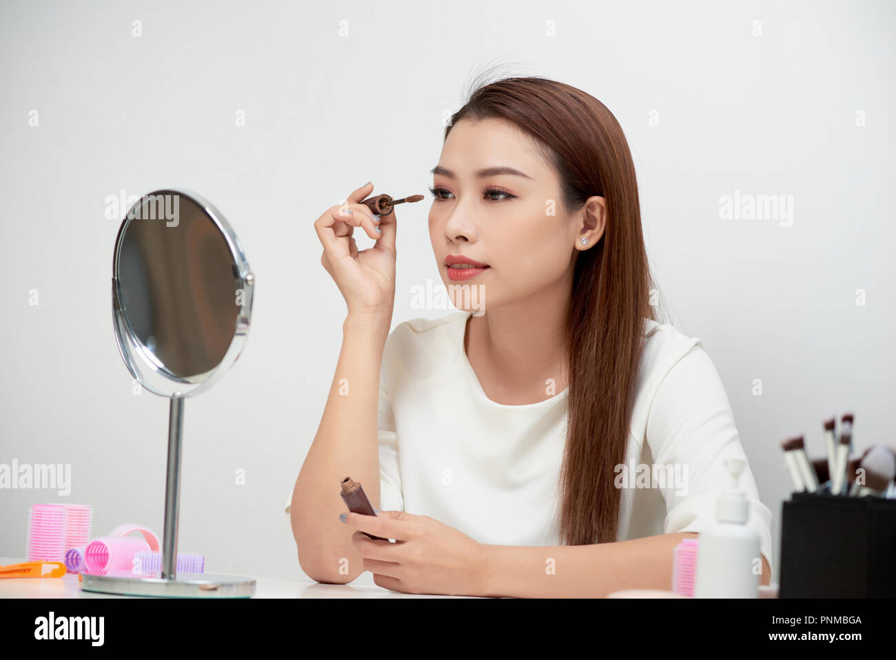 Teenage girl applying makeup hi-res stock photography and images - Alamy