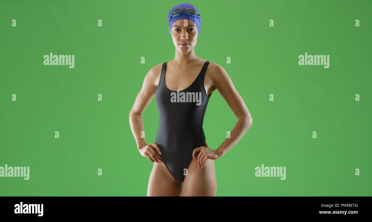 Young Black Female Swimmer In One Piece Swimsuit And Swim Cap On Green Screen Stock Photo Alamy