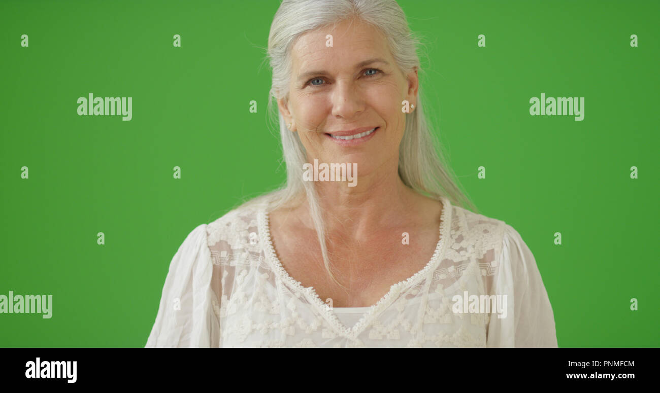 Happy old Caucasian woman looking at camera on green screen Stock Photo ...