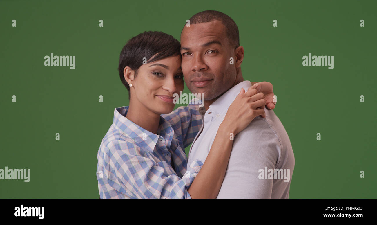 African American couple pose for a portrait on green screen Stock Photo ...