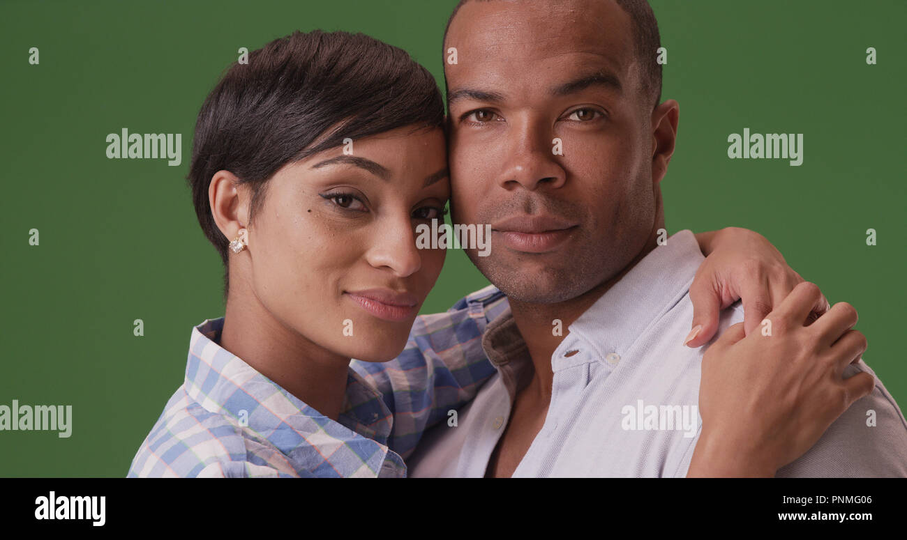 African American couple pose for a portrait on green screen Stock Photo ...