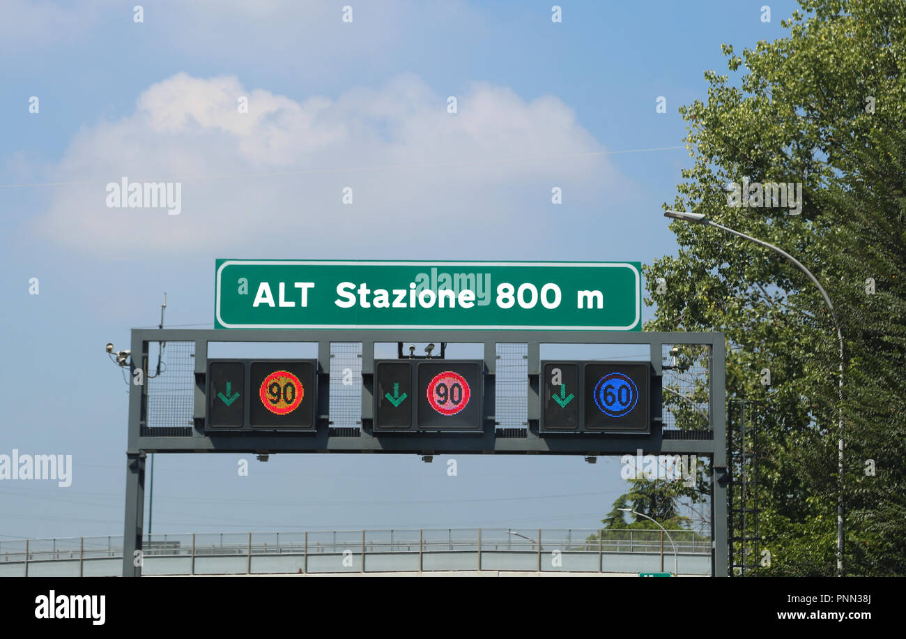 Big road signs on the highway. The text means STOP Station at 800 meters Stock Photo Alamy