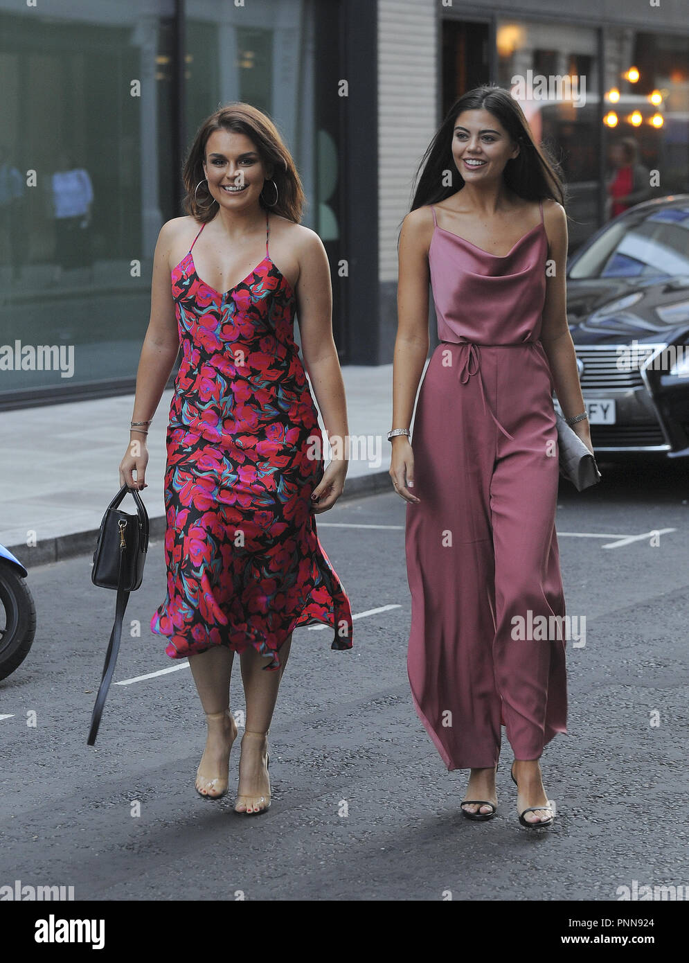 Tallia Storm and Emily Canham are all smiles for the cameras while out