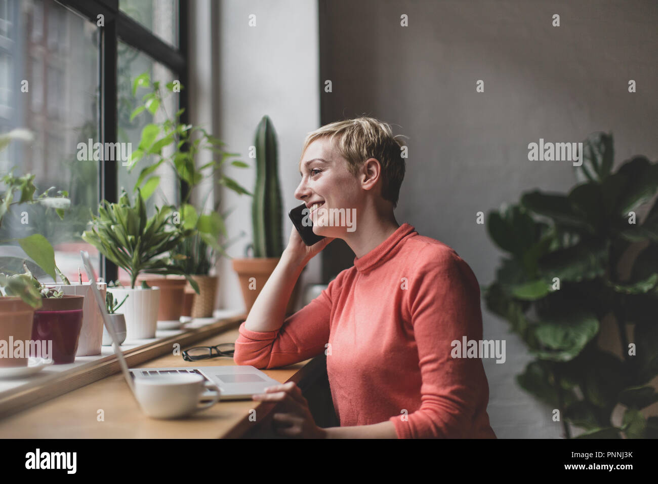 Freelance businesswoman working in a cafe Stock Photo