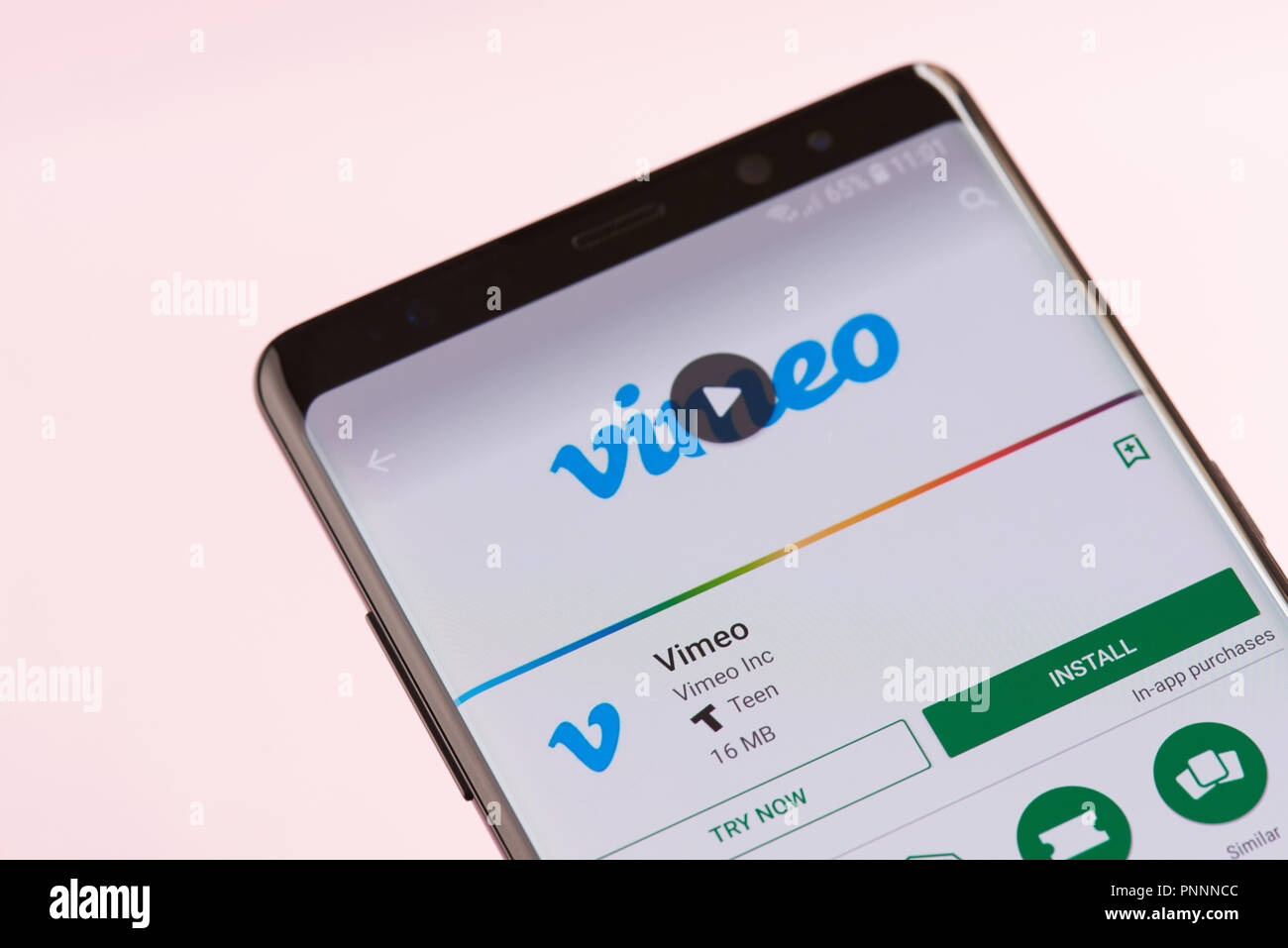 New york, USA - september 21, 2018: Installing video vimeo service on smartphone screen background close up view Stock Photo