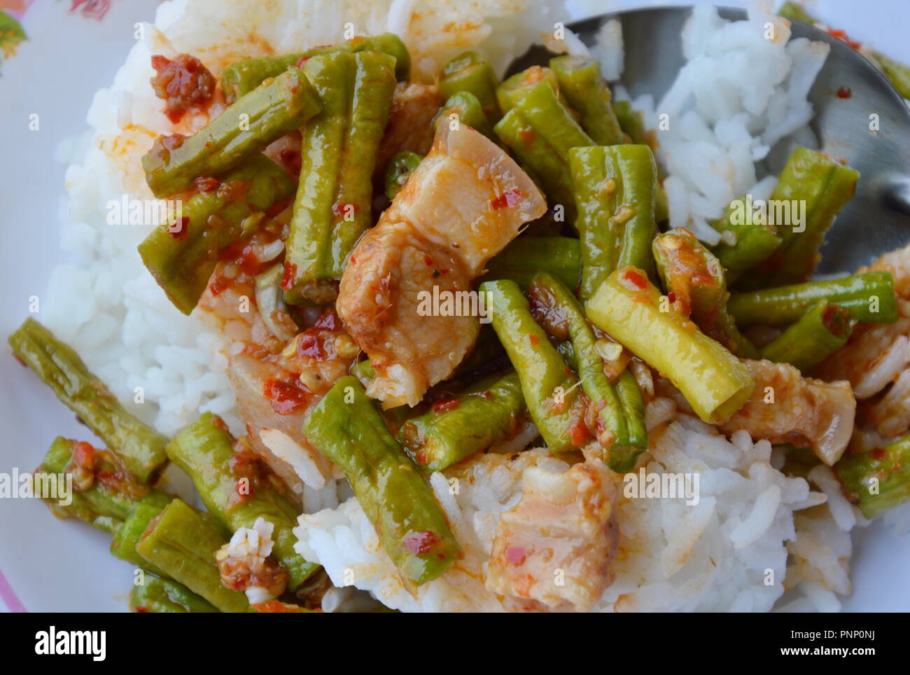 stir-fried curry yard long bean with fat pork Thai easy lunch Stock Photo