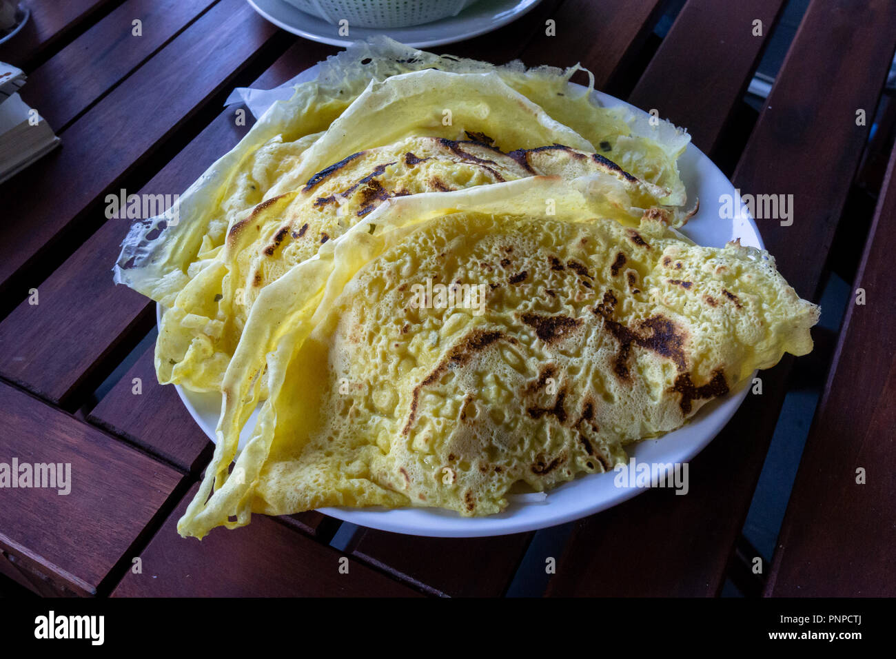 Homemade crispy savory vietnamese yellow pancakes Stock Photo
