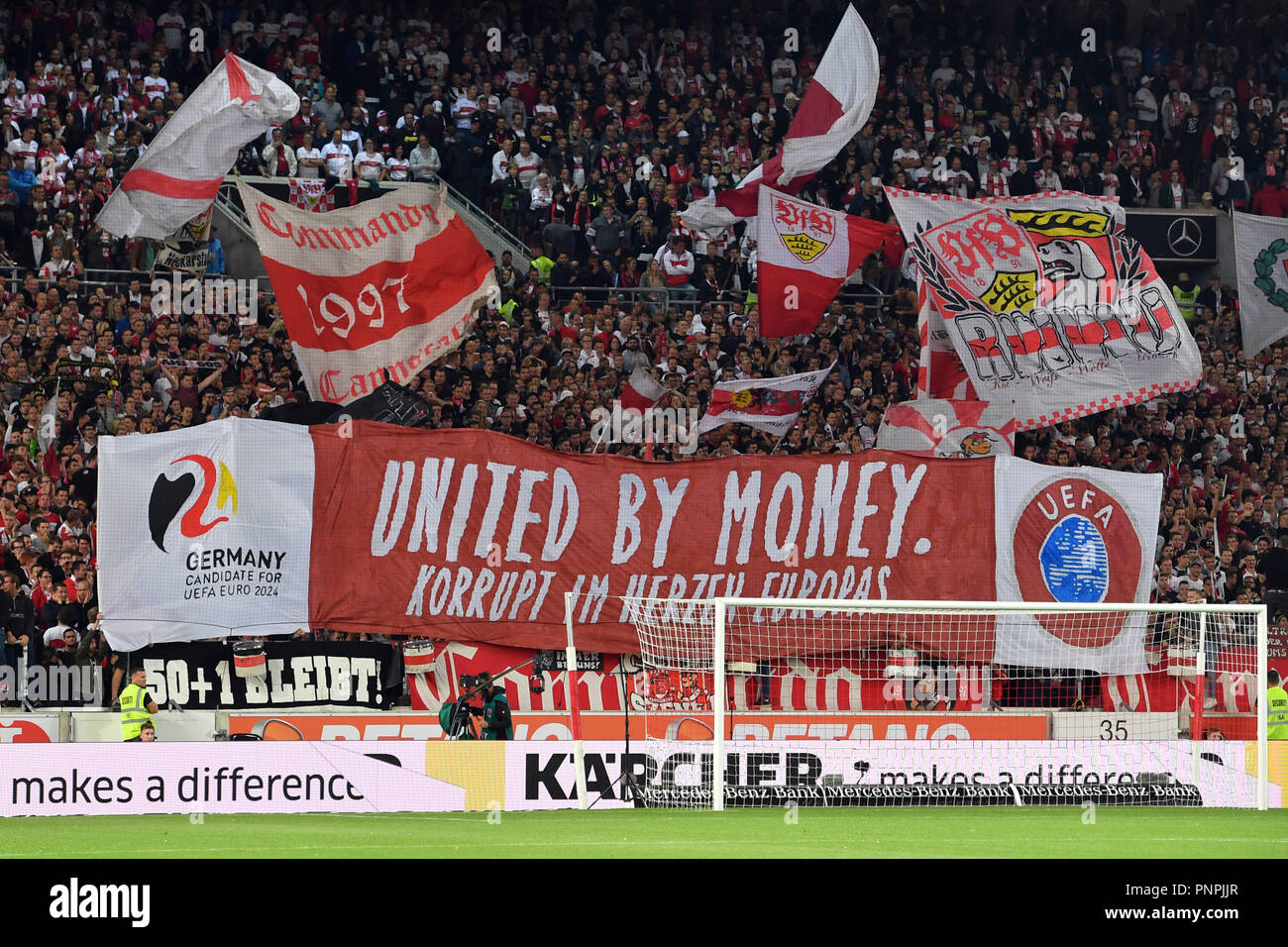 Stuttgart, Germany. 22nd Sept 2018. UNITED BY MONEY! CORRUP IN THE HEART OF  EUROPE. Fans of Stuttgart, football fans, Ultras demonstrate with a banner,  Transparent versus the DFB and the application for