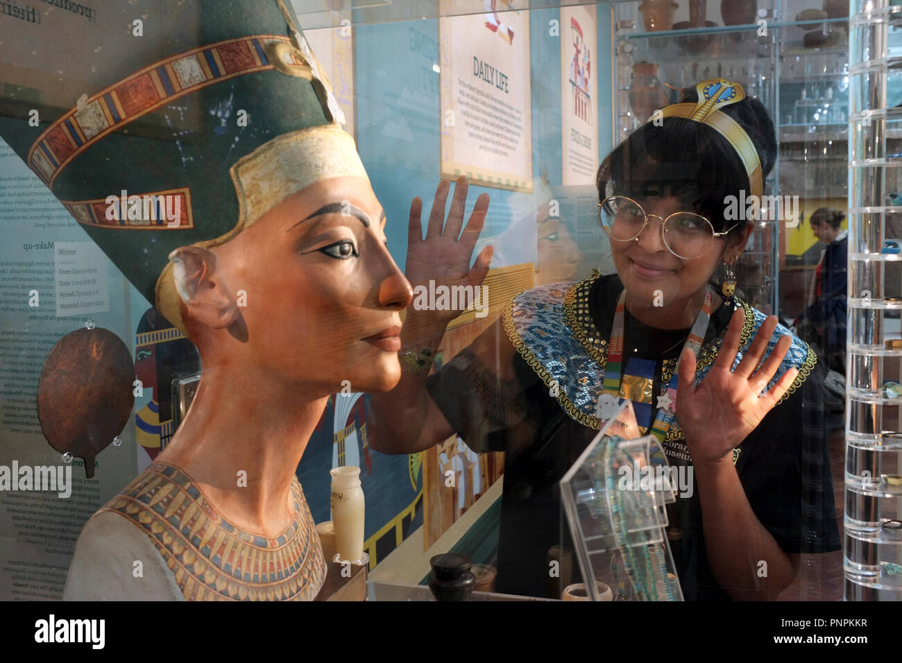 22-09-2018 Bolton Museum & Art Gallery reopens to the public after a £3.8 million revamp with extensive improvements to the Egyptology gallery. Bolton’s collection is one of the most significant ancient Egyptian collections in the UK Shaheen Mogradia visitor engagement assistant is pictured with a bust of Nefertiti dated 1340 BC which was discovered in 1912 this is an early 20th Century copy. photo Don Tonge Stock Photo