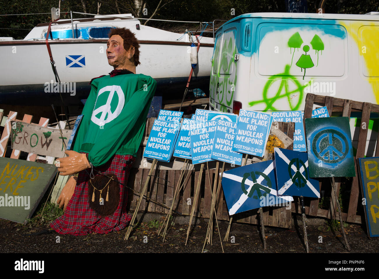 Faslane, Scotland, on 22 September 2018. 'Nae (No) Nukes Anywhere' anti-nuclear weapons demonstration at the Faslane Peace Camp and walking to a rally outside HM Naval Base Clyde, home to the core of the UK's Submarine Service, in protest against Trident nuclear missiles. The rally was attended by peace protestors from across the UK who came 'to highlight the strength of support from many UN member states for Scotland, a country hosting nuclear weapons against its wishes'. Photo Credit Jeremy Sutton-Hibbert/ Alamy News. Stock Photo