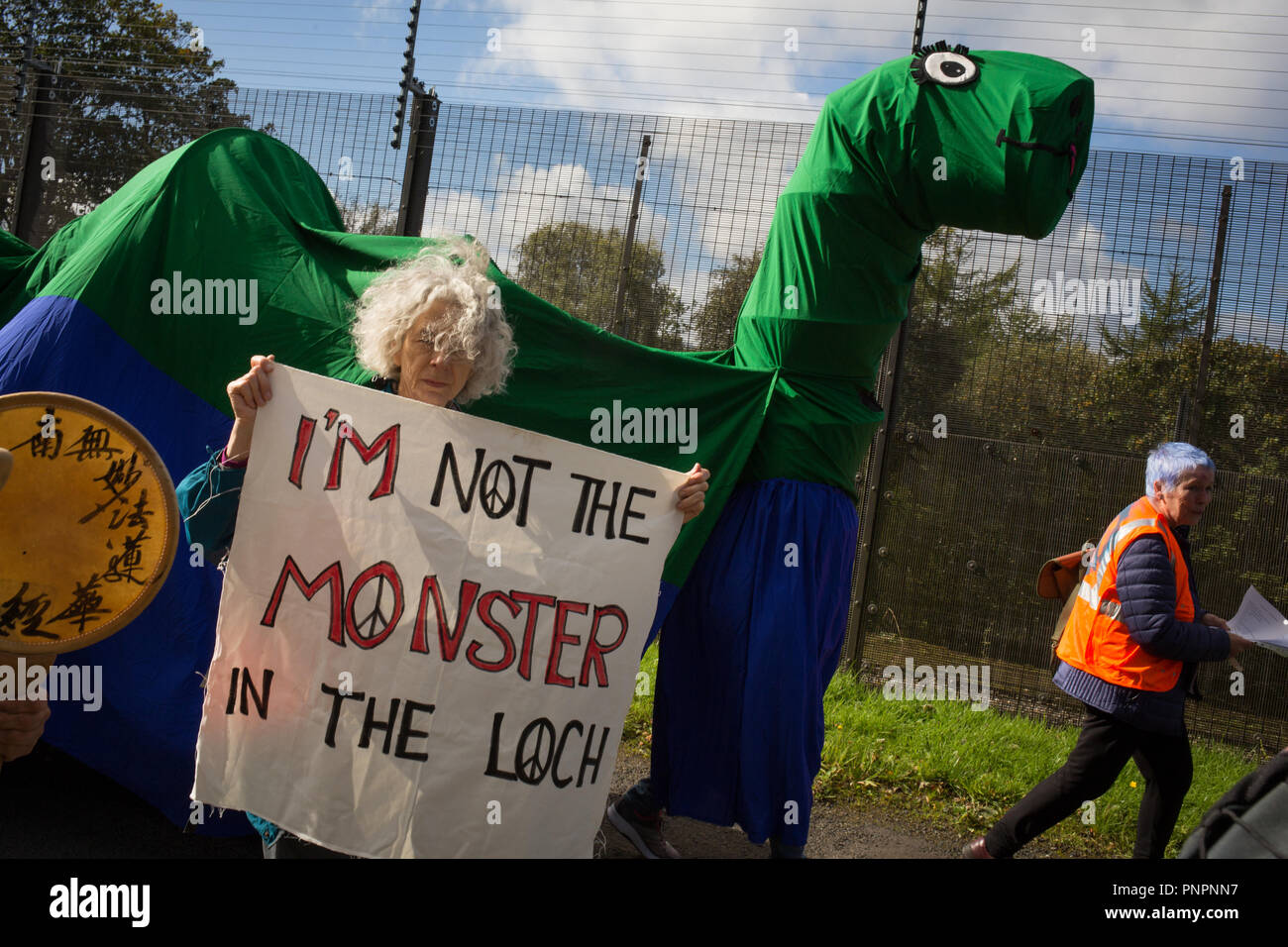 Faslane, Scotland, on 22 September 2018. 'Nae (No) Nukes Anywhere' anti-nuclear weapons demonstration at the Faslane Peace Camp and walking to a rally outside HM Naval Base Clyde, home to the core of the UK's Submarine Service, in protest against Trident nuclear missiles. The rally was attended by peace protestors from across the UK who came 'to highlight the strength of support from many UN member states for Scotland, a country hosting nuclear weapons against its wishes'. Photo Credit Jeremy Sutton-Hibbert/ Alamy News. Stock Photo