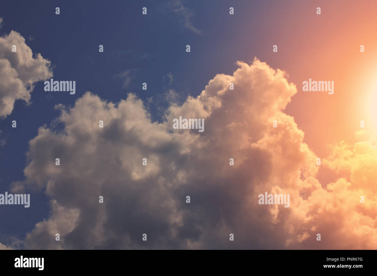 Nature background. Fluffy soft clouds in sky toned Stock Photo - Alamy