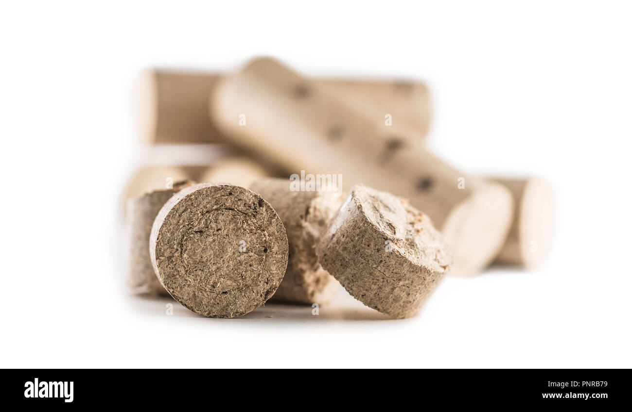 Wooden pressed briquettes from biomass on a white isolated background Stock Photo