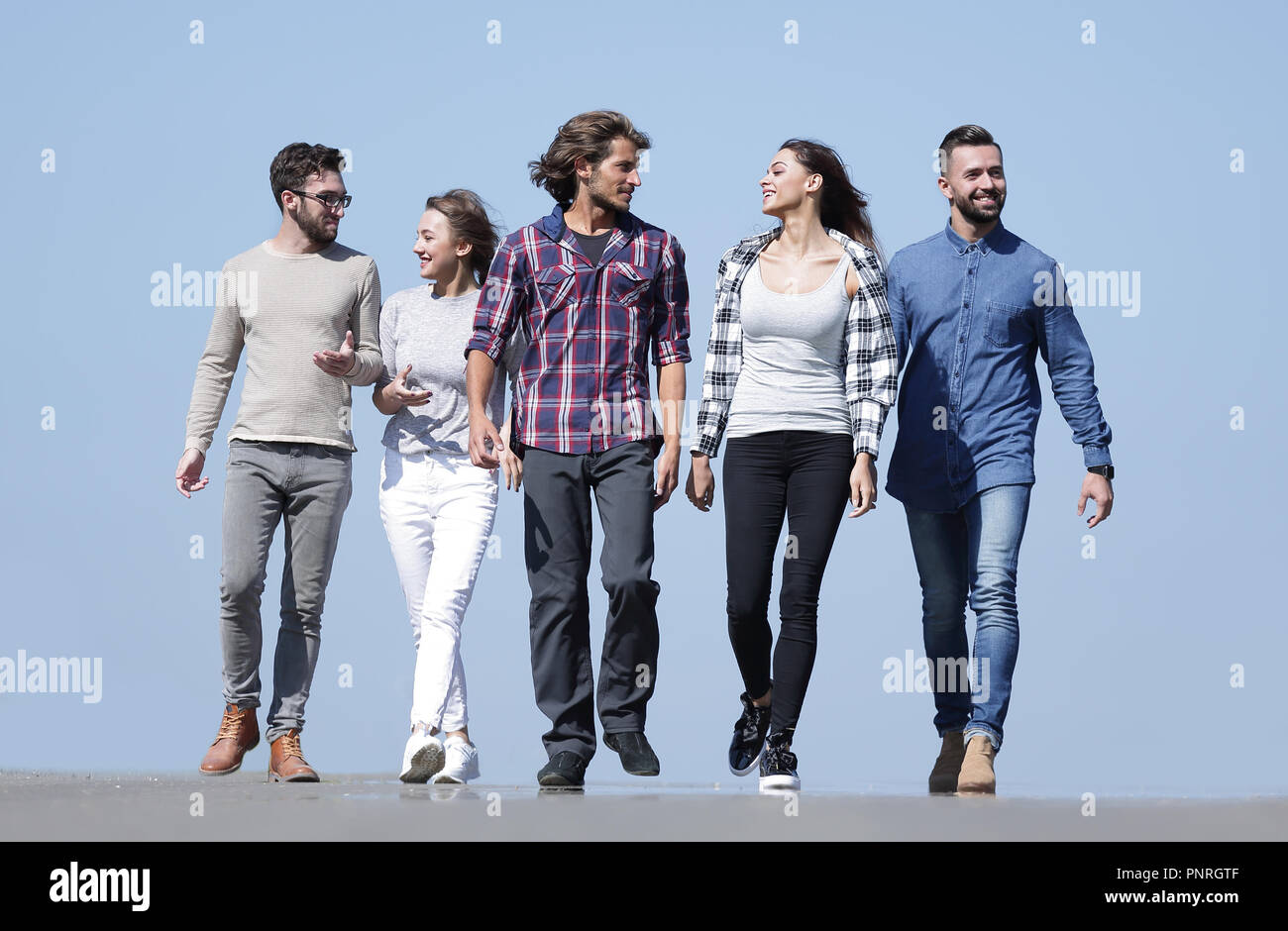 team of young people walking along the road.outdoors Stock Photo - Alamy