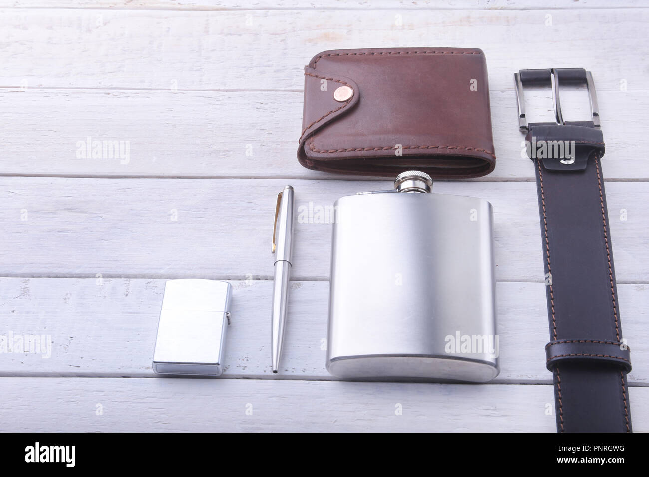 Gadgets And Accessories For Men On Light Wooden Background. Fashionable Men  S Belt, Wallet, Lighter, Stainless Hip Flask And Pen. Stock Photo, Picture  and Royalty Free Image. Image 103519842.