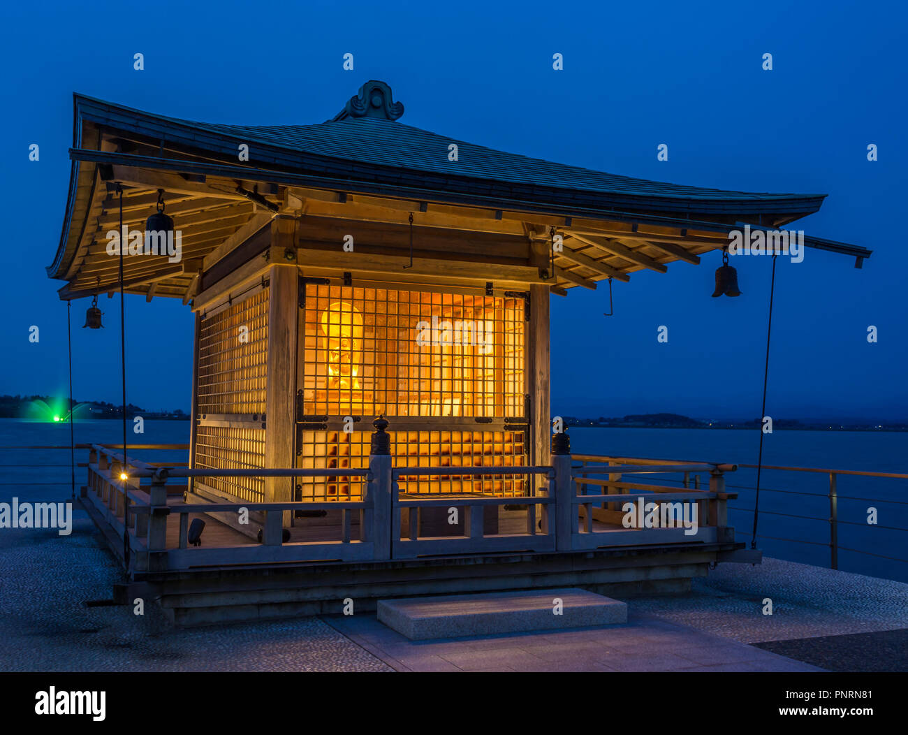 Tiny shrine on lake jetty, Shibayamagata Lake, Japan Stock Photo