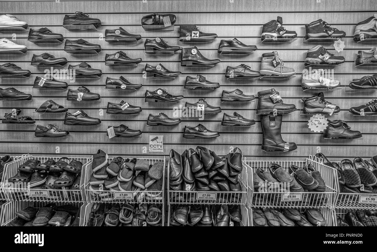 Shoes on sale in Bury Market, UK. Stock Photo