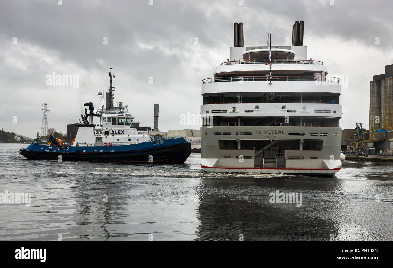 Cork, Ireland. 01st May, 2018 Tug boat Alex helps manouver cruise liner Le Soléal to her berth on Custom House Quay in Cork City.- Stock Photo