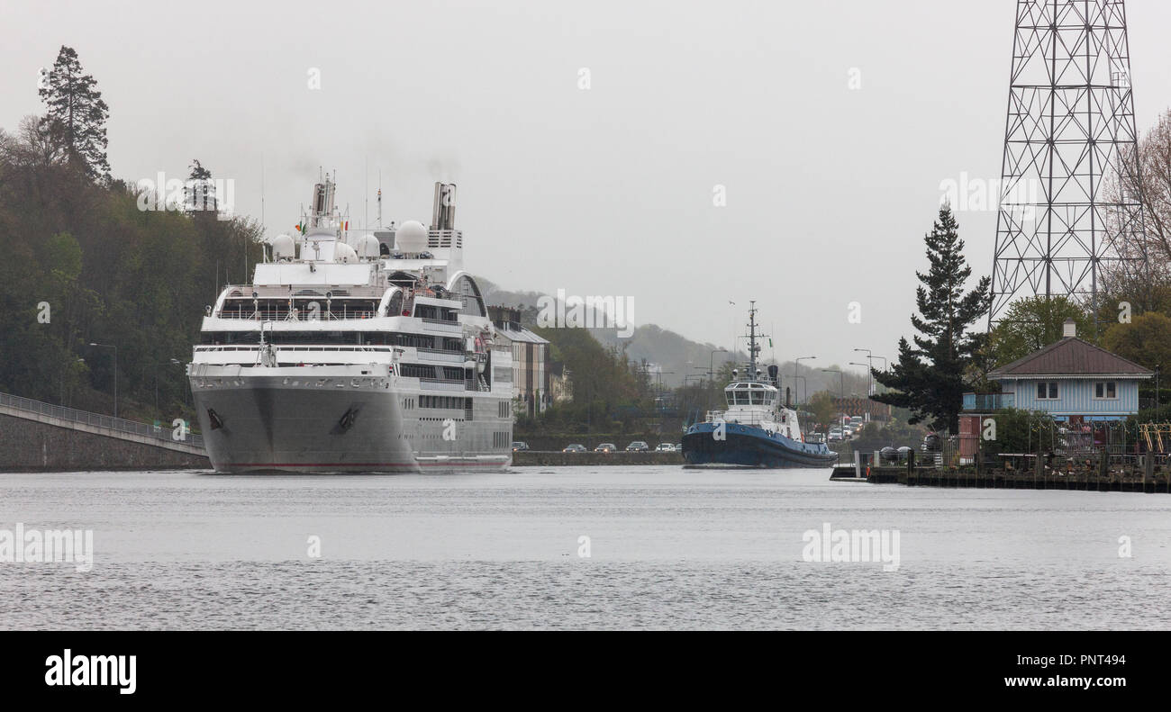 Cork, Ireland.  01st May 2018.  Cruise liner Le Soléal is escorted by the tug boat Alex as they pass  the Shandon Boat Club on there way to Custom Hou Stock Photo