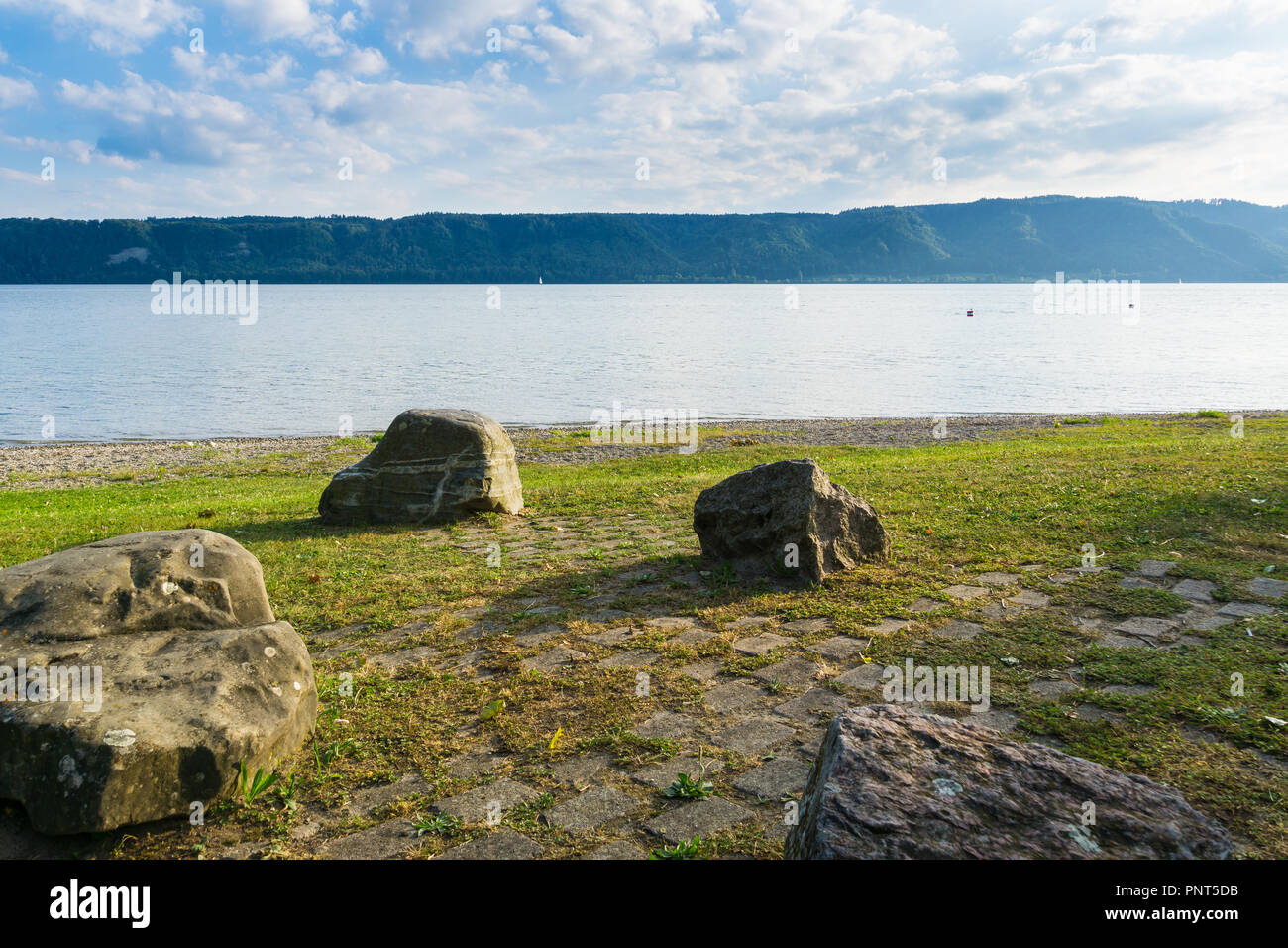 Stones at shore of lake Stock Photo