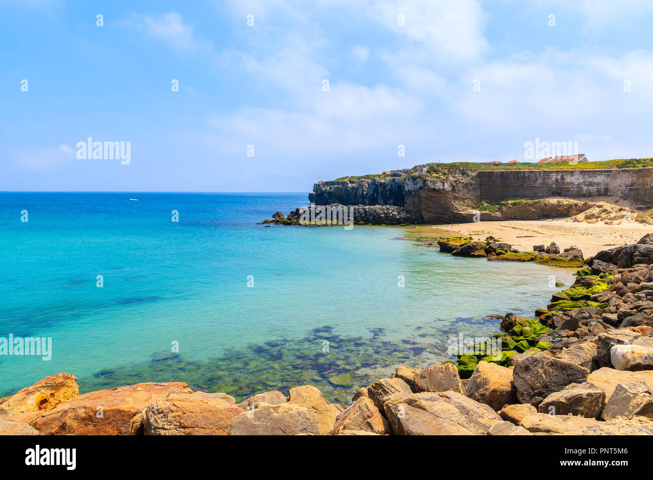 Rocks on sea coast and view of beach in Tarifa town, Costa de la Luz, Spain Stock Photo