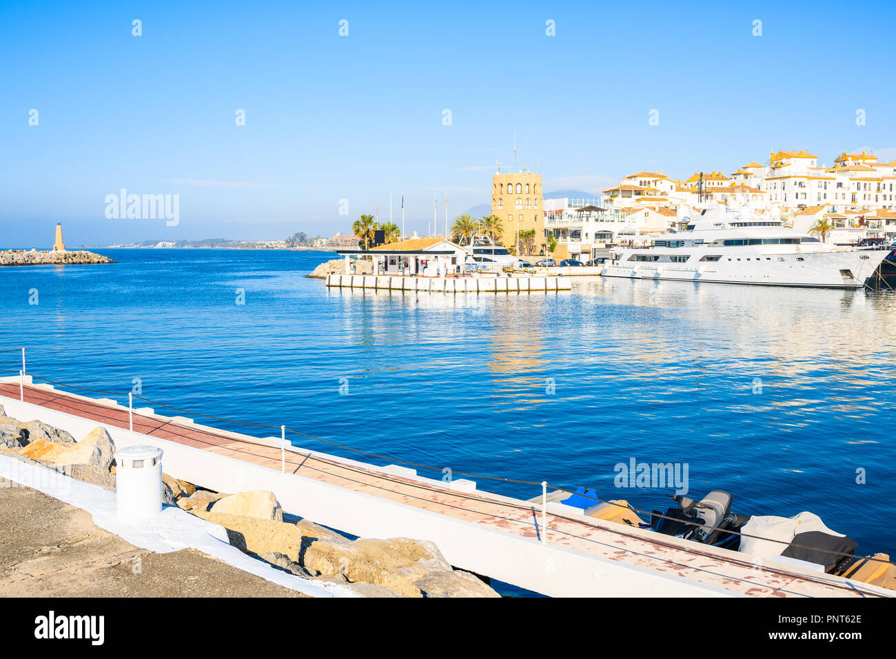 View of Puerto Banus marina with boats and white houses in Marbella town, Andalusia, Spain Stock Photo