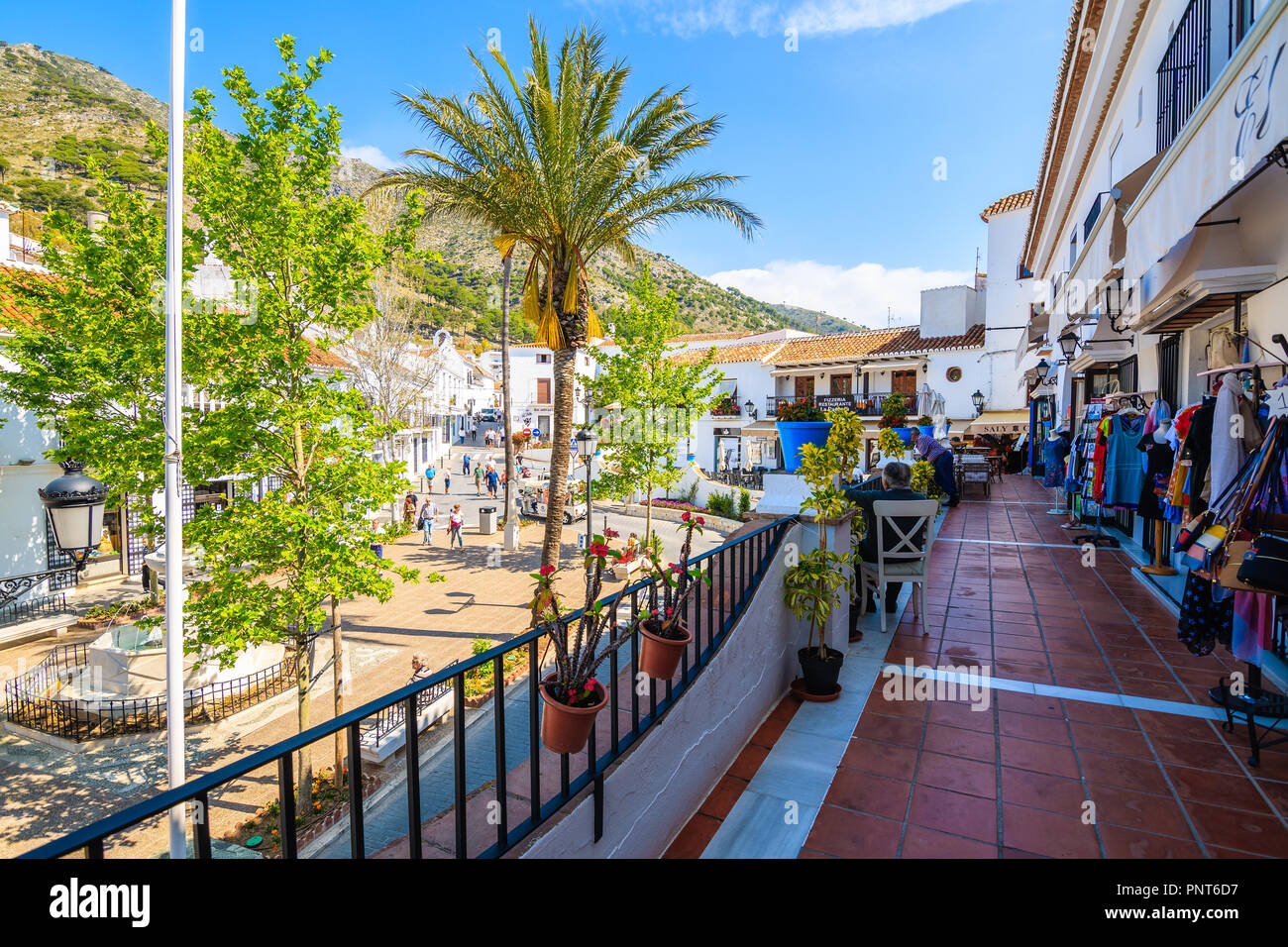 MIJAS VILLAGE, SPAIN - MAY 9, 2018: Street with shops in picturesque white village of Mijas, Andalusia. Southern Spain is famous for mountain villages Stock Photo