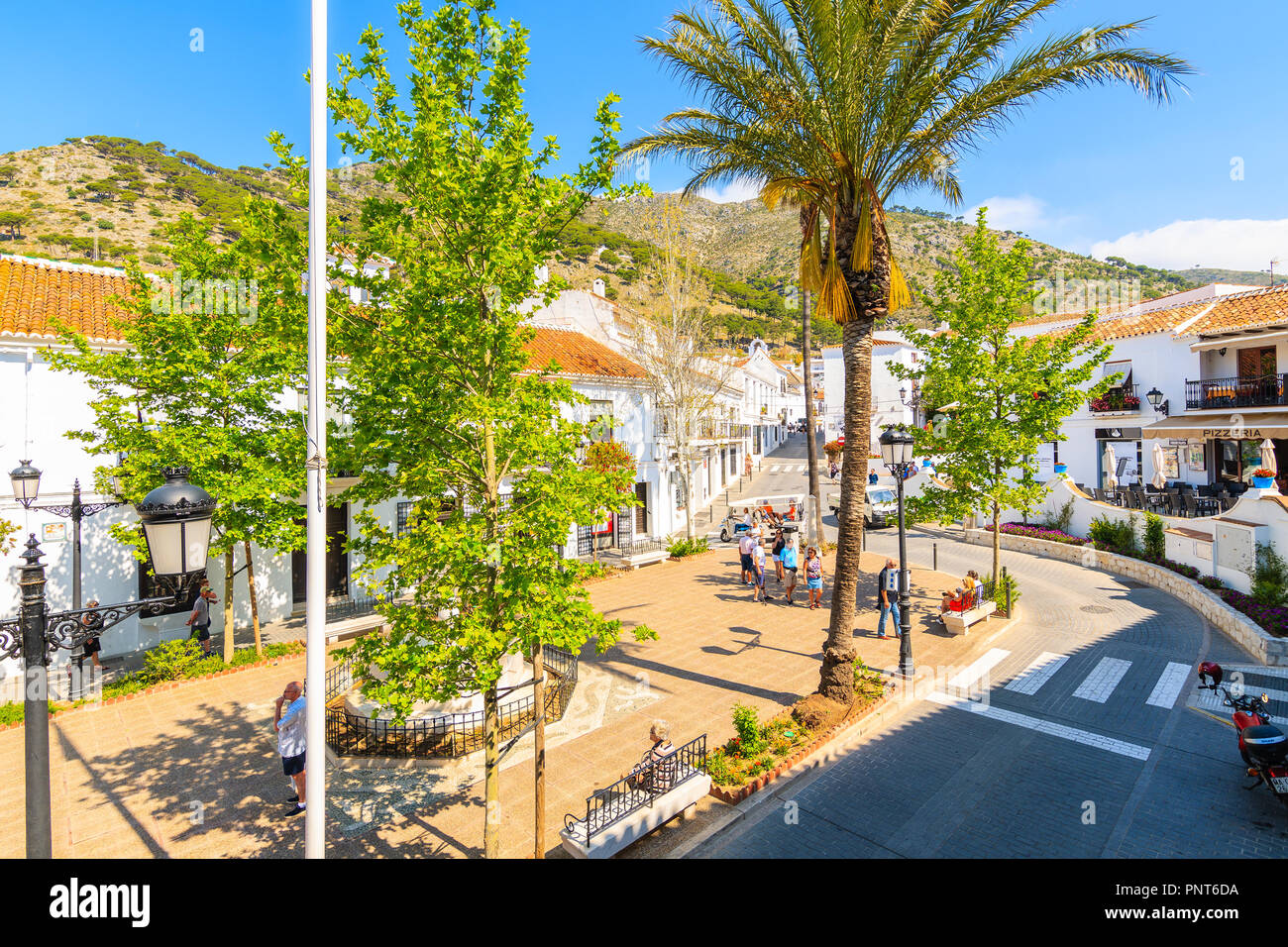 MIJAS VILLAGE, SPAIN - MAY 9, 2018: Street in picturesque white village of Mijas, Andalusia. Southern Spain is famous for mountain villages with white Stock Photo