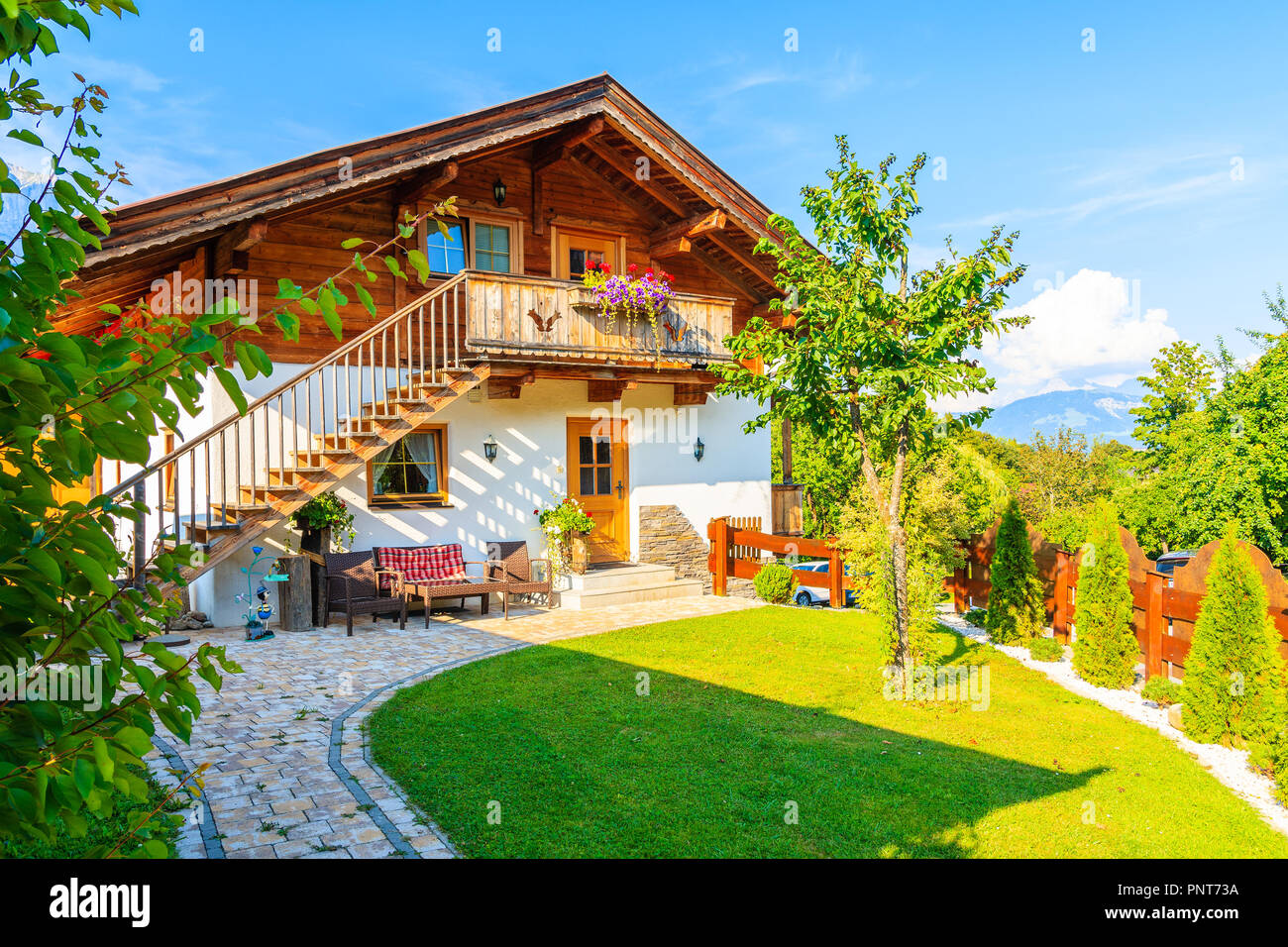 Typical wooden alpine house in Going am Wilden Kaiser village on sunny summer day, Tyrol, Austria Stock Photo