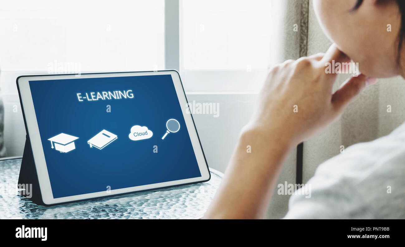 Online education, e-learning and e-book concept. a man using digital tablet for education Stock Photo