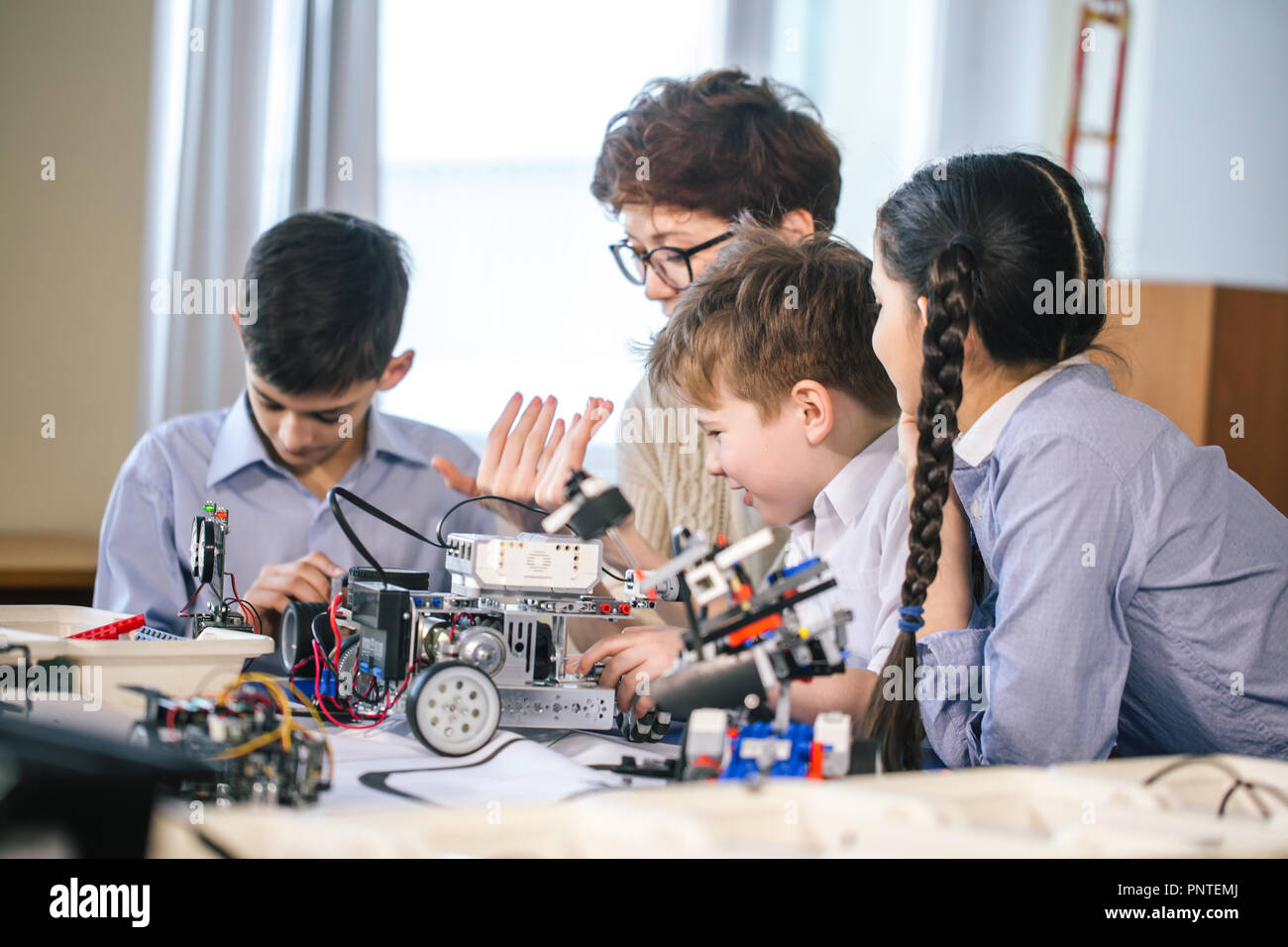 Happy children learn programming using laptops on extracurricular ...