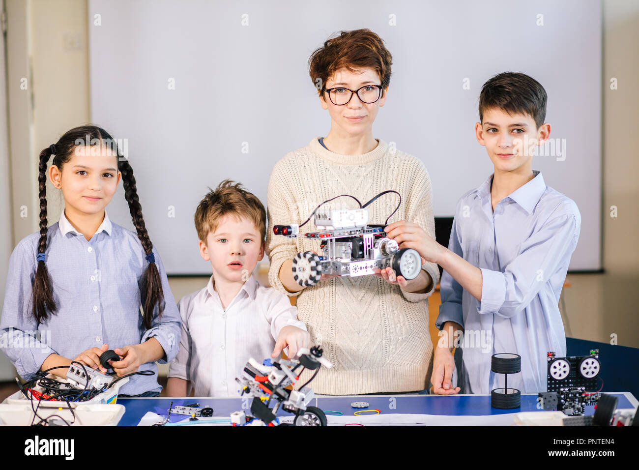 Happy children learn programming using laptops on extracurricular ...