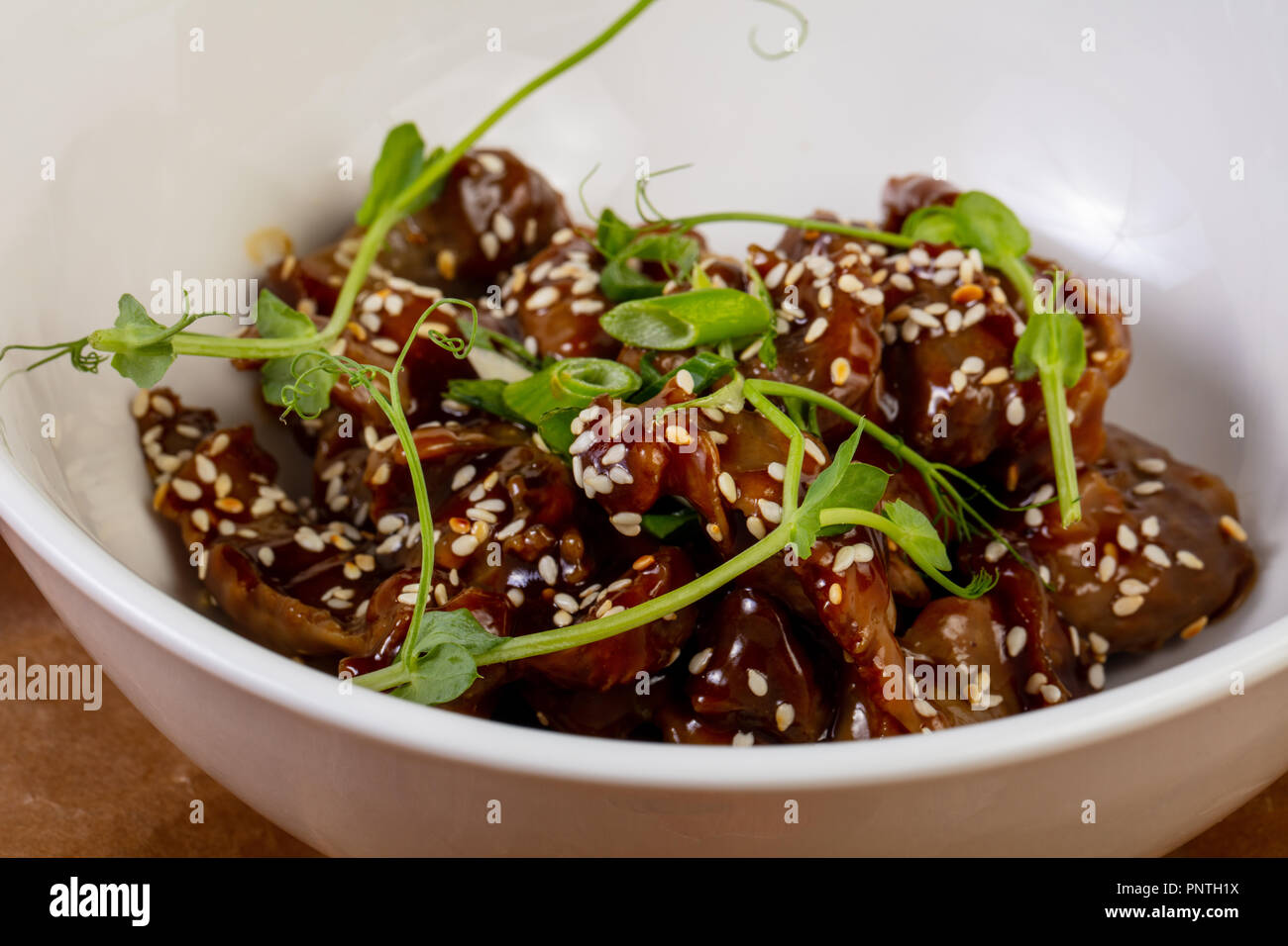 Roasted chicken giblets served sesam seeds Stock Photo Alamy