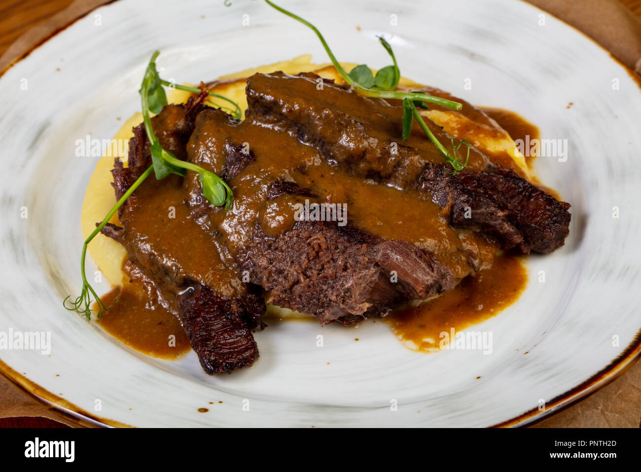 Roasted beef with gravy and mashed potato Stock Photo Alamy