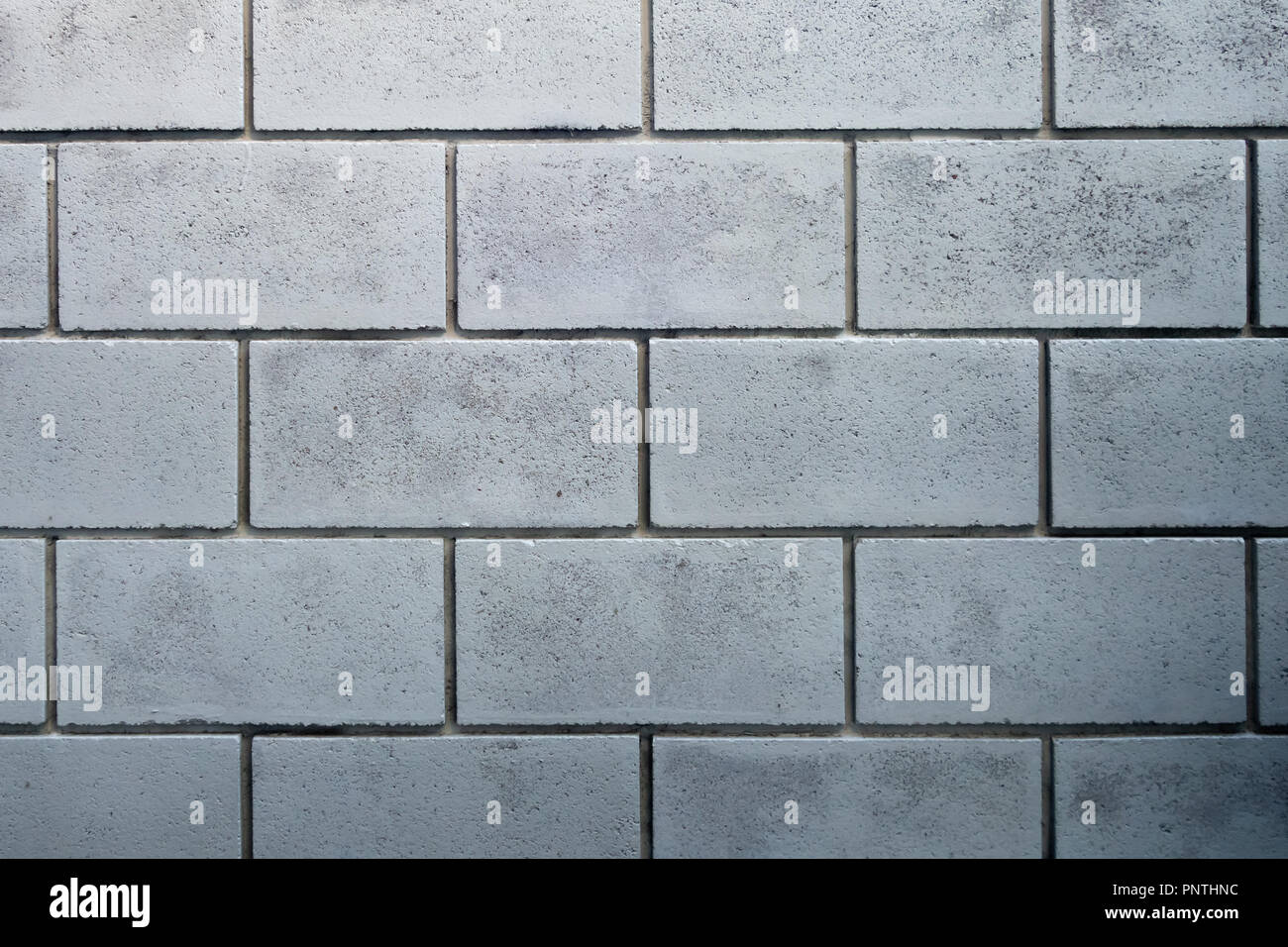 cinder block grey brick wall texture background Stock Photo