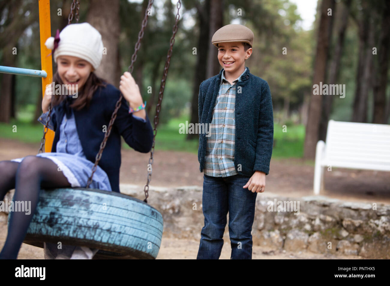 Boy girl playing in playground hi-res stock photography and images - Alamy