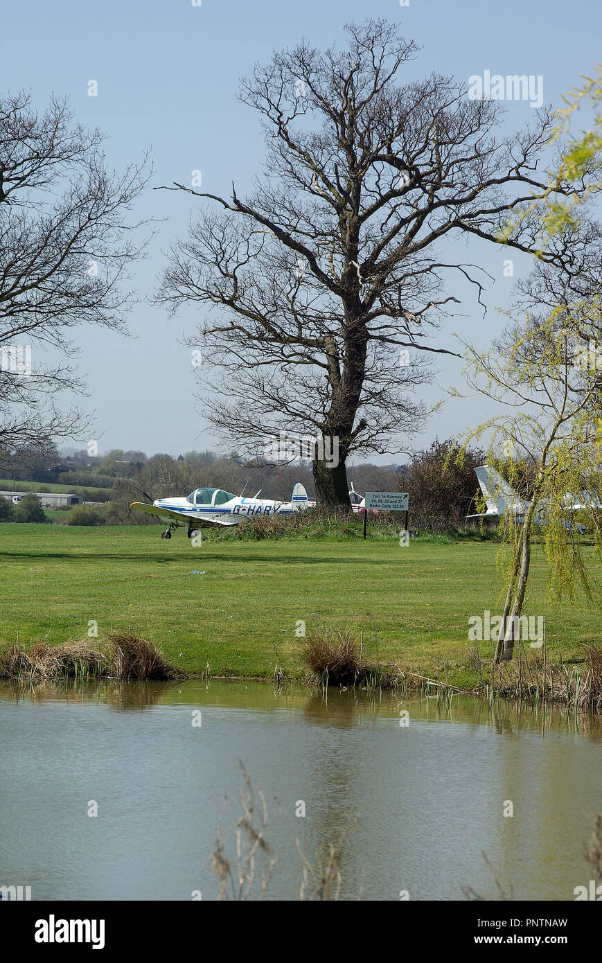 RAeC Air Race Series, Round One 2010 at Great Oakley airfield in Essex, UK. Countryside airfield with pond and trees among the taxiways Stock Photo