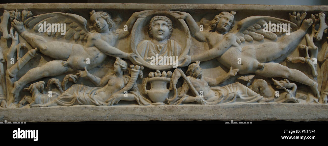 Roman Art. Marble sarcophagus with flying erotes holding a clipeus portrait. At the bottom, the Earth and the Ocean. Dated between 190-200. Severan period. Metropolitan Museum of Art. New York. United States. Stock Photo